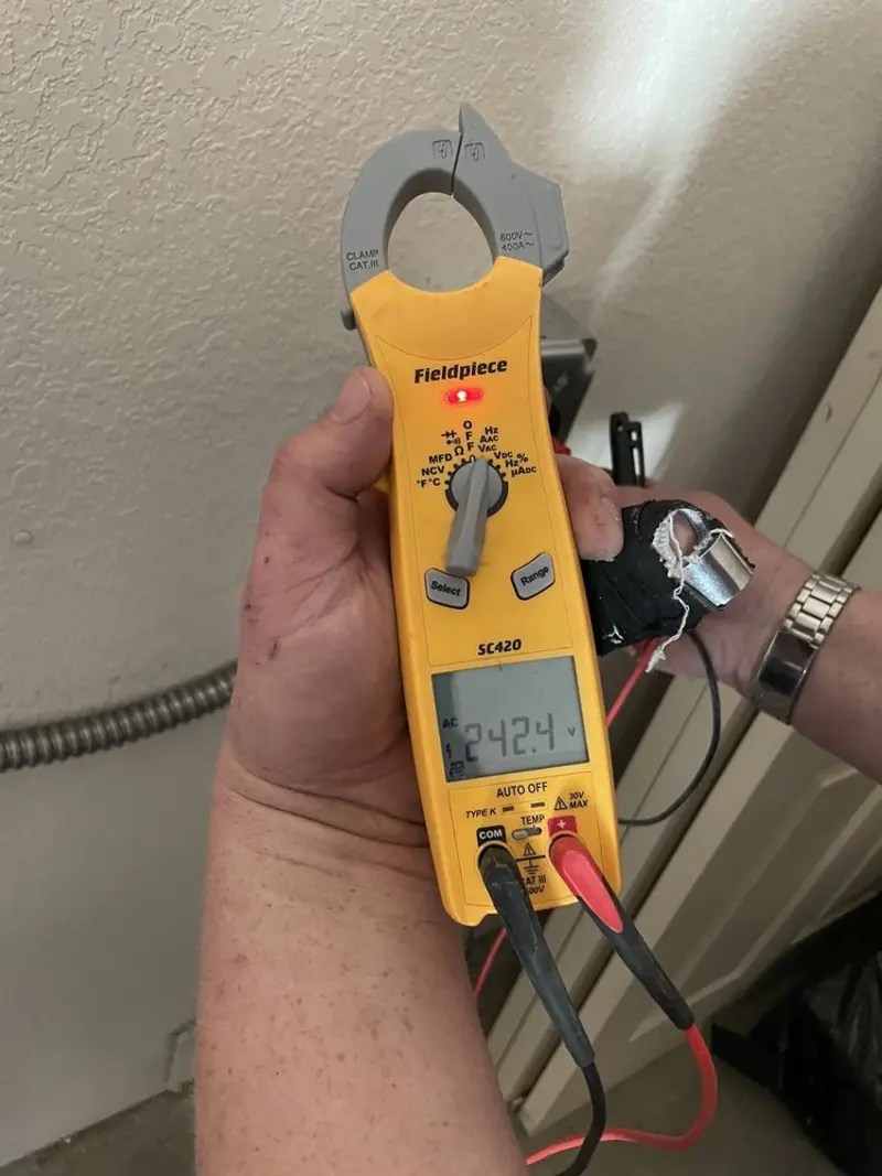 Voltage testing with clamp meter during Outlet Installation in Burbank
